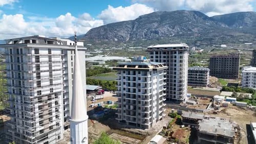 Aerial View of Urban Construction with Mountain Backdrop