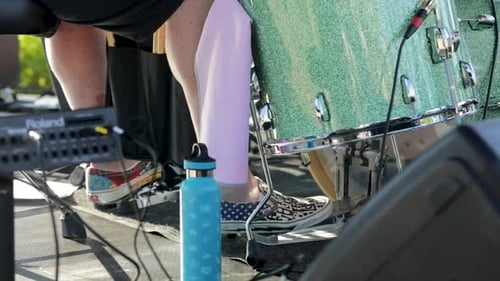 Drummer's Foot On Kick Drum Peddle And Hitting Kick Drum During Outdoor Performace. - Close Up Shot
