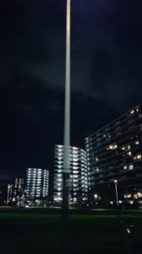 High-Rise Residential Buildings Illuminated at Night in Amsterdam Noord