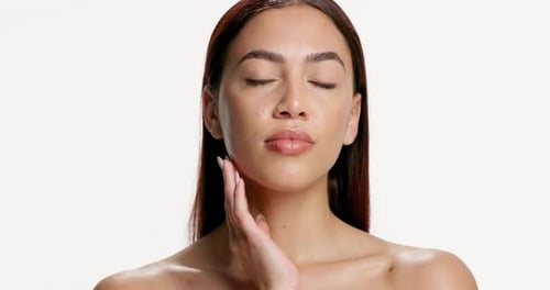 Face, skincare and glow with woman in studio for cosmetology, wellness and manicure