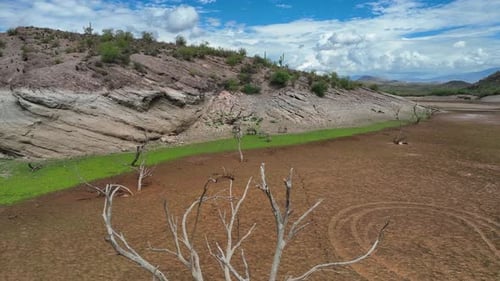 Aerial view of dry lakebed near hills, United States.