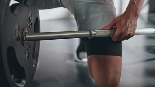 Closeup Athletic Man Hands Put Heavy Plates Barbell at Fitness Training Workout