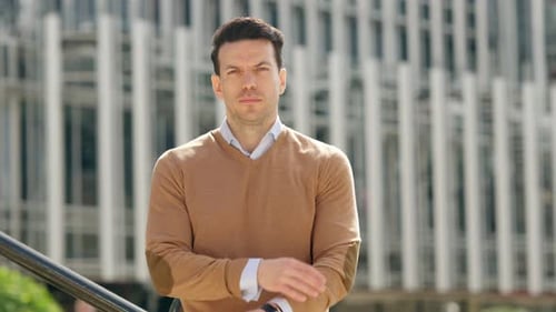 Serious Businessman Looking at the Camera with Arms Crossed