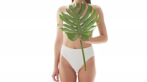 Beautiful Woman in White Underwear Over Isolated White Background Closeup Studio Video of Healthy