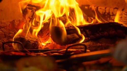 Roaring Fire Burning with Food in Wood Oven