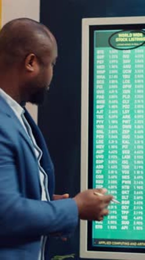 Adults in a Corporate Business Meeting with Touchscreen