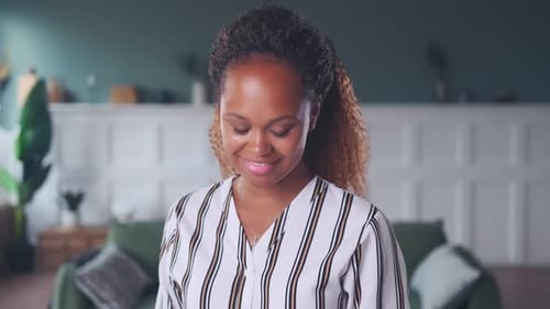 Smiling Woman Makes Heart Shape With Hands