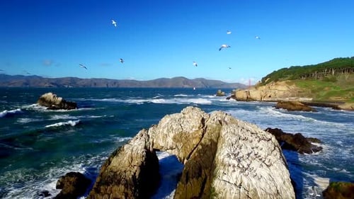 Drone View Of Choppy Ocean And Rocks By San Francisco Beachside 2