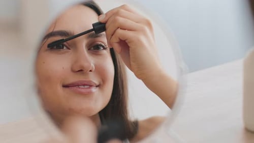 Young Arab Woman Applying Mascara at Home Enjoying Her Beauty Routine