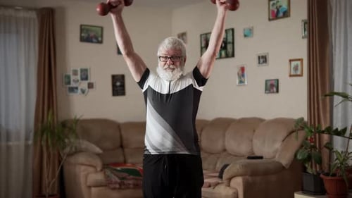 Senior Man Exercising with Dumbbells in Living Room