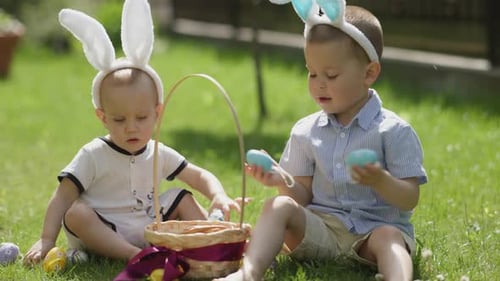 Happy Easter Two Little Siblings Sit Green Grass Wear Bunny Ears Play Easter Egg