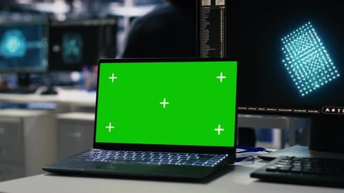 Data Center Engineer Working on Neural Network on Chroma Key Laptop