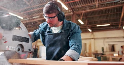 Saw, machine and man in workshop with wood project in carpentry and process of cutting plank