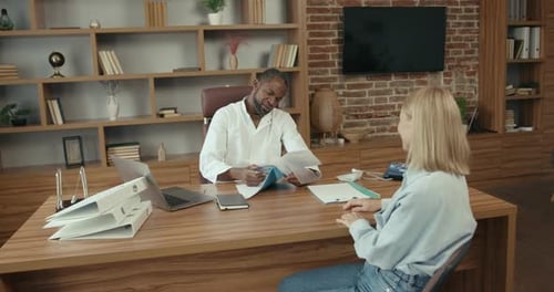 Doctor Consults with Patient in Modern Office
