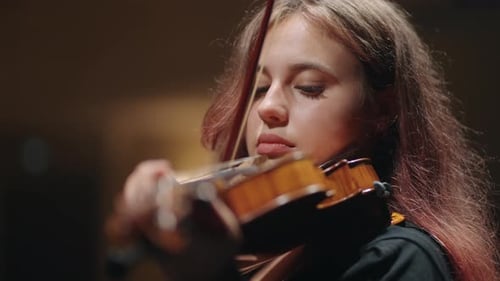 Young Woman Plays Violin Close Up Indoors