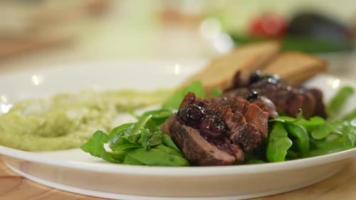 Elegant Gourmet Food Dish with Meat and Berries