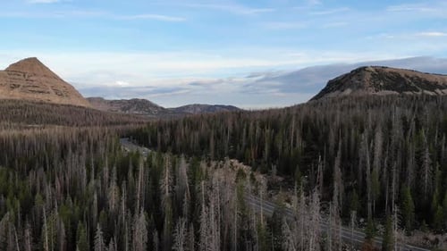 Aerial footage over high rocky mountain wilderness. Lakes and mountain peaks and ridges can be seen