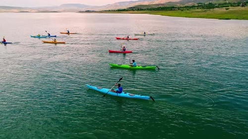 Kayakers Paddling on a Lake Aerial View