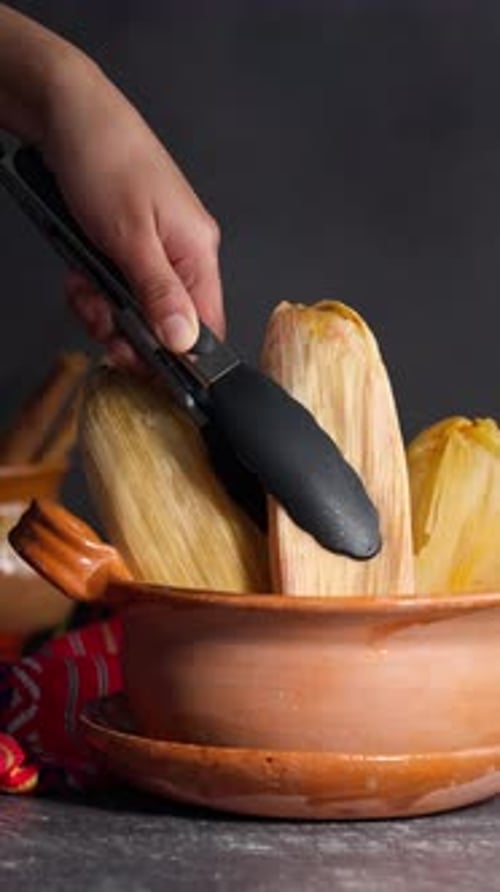 Corn Tamales Placed in Clay Pot on Table