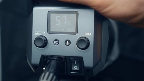 Turning on Lighting Equipment for Video Shooting and Adjusting Direction of Light Beam Man Hand