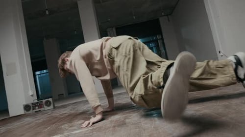 Creative Gen Z B-Boy Improvising while Performing Down Rock of Breakdance