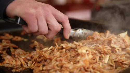Seasoned Meat Cooking on a Hot Grill