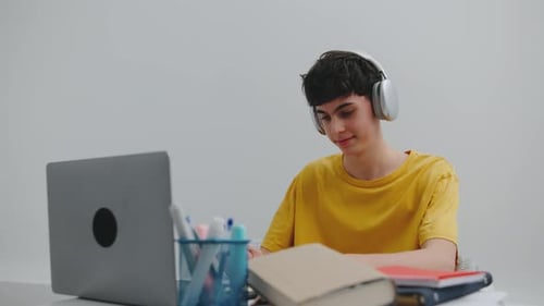 Teenage Boy Studying at His Desk