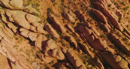 Descending over the rocks diverse in size and shape. Arches canyon in Utah, USA