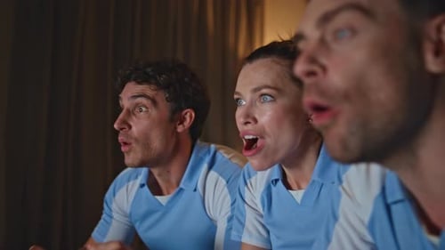 Excited People Cheering Sport Game at Evening Living Room Close Up Happy Fans