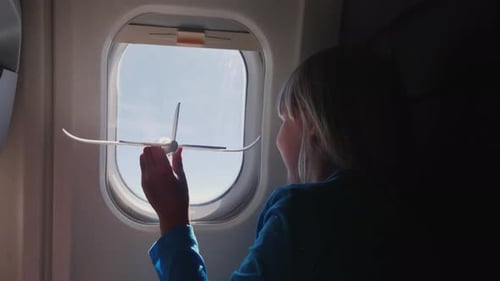 Girl Travels by Airplane with Toy Plane