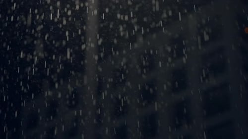 Rain Falling in the City at Night