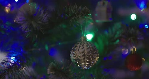 Happy New Year Christmas Tree Decorates on Branch Snow on Background Bokeh of Side Flickering Light