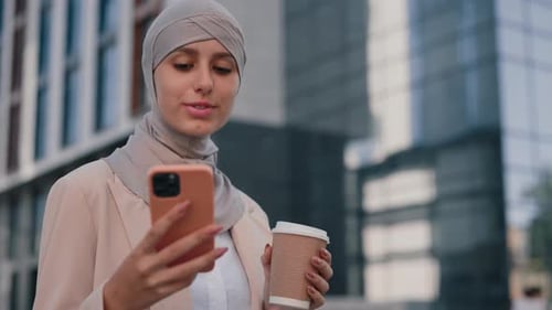 Side View of the Busy Smiling Businesswoman Walks Drinking Coffee Enter Office Building Using