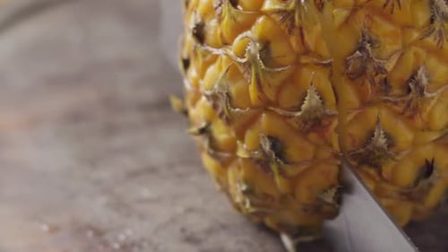 Cutting Ripe Pineapple with a Sharp Knife
