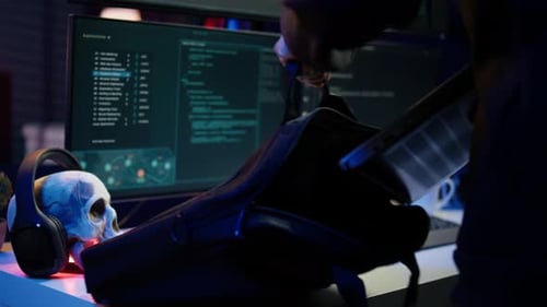 Cybercriminal Opening Notebook to Exploit Network Backdoors Close Up