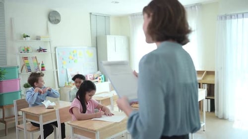 Teacher and students, Learn and study in a classroom of school where youngsters sit and listen