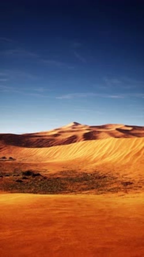 Vast Desert Landscape Under Blue Sky