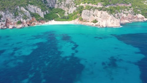 Explore Cala Fuili Beach Sardegna Crystal Clear Waters and Scenic Cliffs