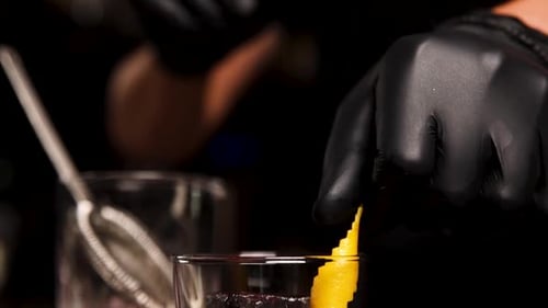the bartender prepares a cocktail at the bar