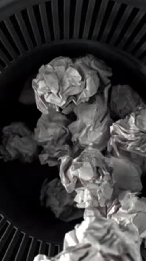 Crumpled Paper Falls Into the Trash Can Filmed on a Highspeed Camera at 1000 Fps