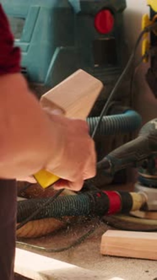 Vertical Video Coworking Artisans in Studio Using Sandpaper and Wood Shaper