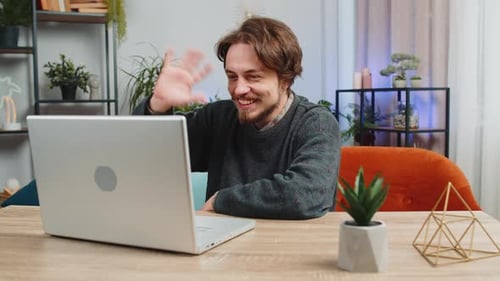 Young Adult Using Laptop for Video Call