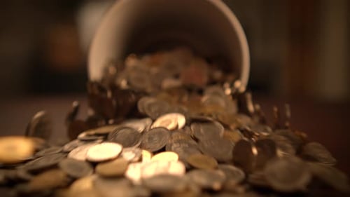 Container spills heap of assorted gold and silver coins