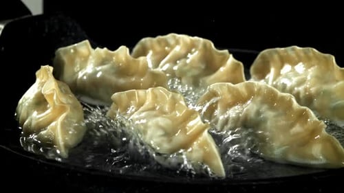 Pan Fried Dumplings with splashing oil