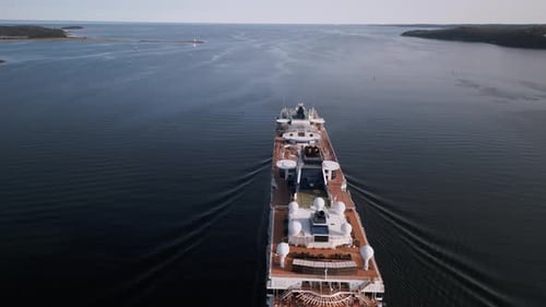 Cinematic Drone Shot of a Large Cruise Ship Leaving Port Into the Open Ocean