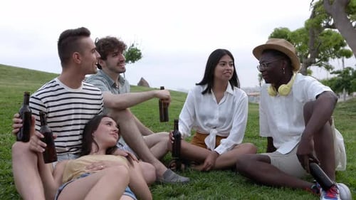United Group of Millennial Best Friends Hanging Out Relaxing on City Park