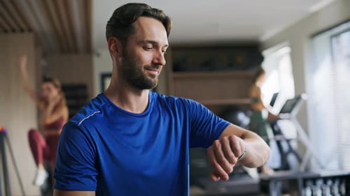 Smiling Athlete Looking Smartwatch Standing in Gym Closeup Portrait Happy Man