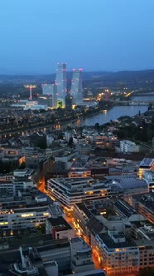 Aerial, drone view of Basel, Switzerland in the evening. Vertical