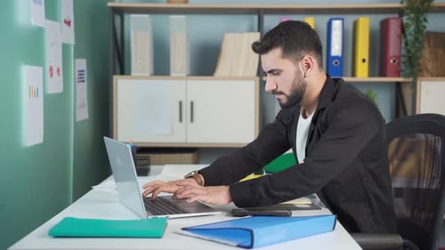 Man Working at Desk in Bright Office