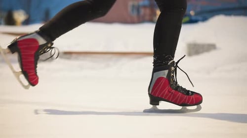 Woman Figure Skating with Red Boots in Winter